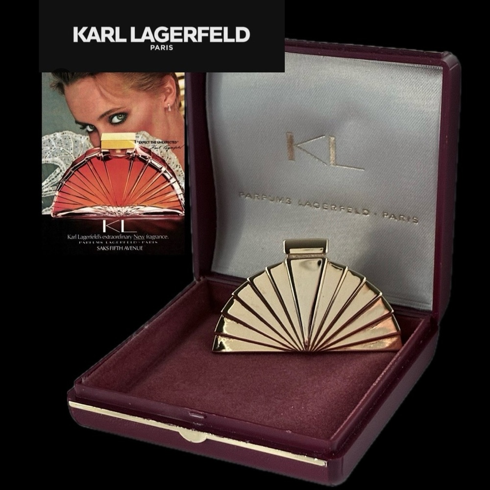 Vintage Karl Lagerfeld Paris Gold Tone Art Deco Fan shaped brooch.
Signed